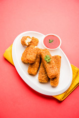 Kurkuri paneer fingers or pakora/pakoda snacks also known as Crispy Cottage Cheese Bars, served with tomato ketchup as a starter. selective focus