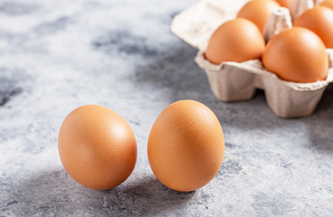 Chicken eggs close-up in  egg cages.On a vintage table.