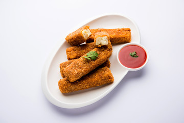 Kurkuri paneer fingers or pakora/pakoda snacks also known as Crispy Cottage Cheese Bars, served...