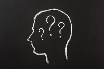 Human brain and question mark draw on blackboard