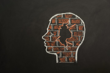Human head with brick wall. Mental block. Symbolized with a brick wall in the brain of a person.
