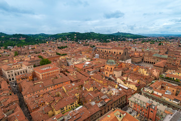Fototapeta na wymiar Top view from the tower Asinelli at Bologna, Italy. Old town, red tiled roofs.
