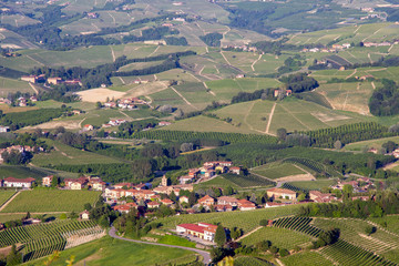 Fototapeta na wymiar Panoramic view of the vineyard hills in the Langhe area, Unesco World Heritage Site since 2014, with the small hamlet of Annunziata, La Morra, Cuneo, Piedmont, Italy