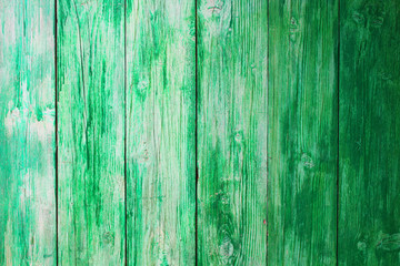 Old green wooden boards. Vertical view. Close-up. Background. Texture.