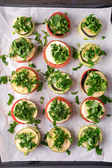 Piles of Raw Eggplants Zucchini Tomatoes Decorated with Chopped Parsley on Baking Tray Ready to Grill or Roast Vegetarian Snack Vegan Diet Healthy Dish