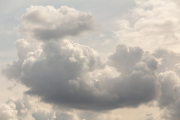 Large heavy white and gray cumulus clouds before a thunderstorm. Close-up