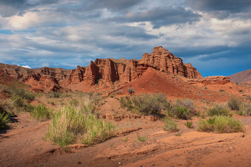 fancy clay castles in the sandy desert of the red canyon Konorchek, in Kyrgyzstan