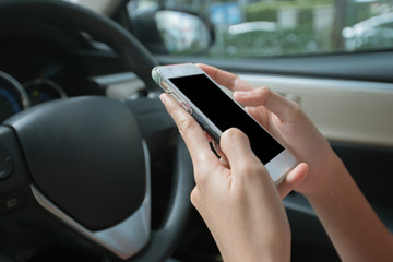 Businesswoman texting, chatting, playing on phone while careless driving.