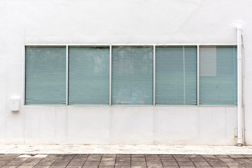 Windows blinds in modern building. Window with rolling shutters pattern wall.