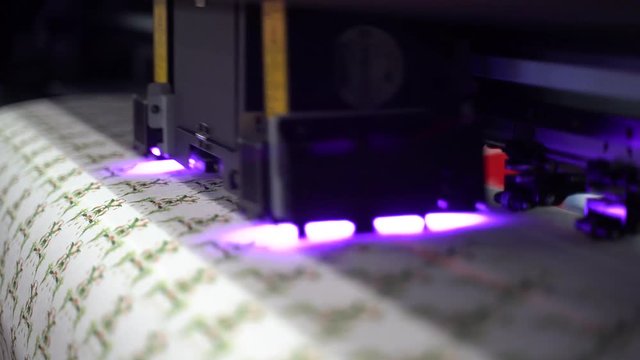 Super slow motion shot UV LED textile laser printer