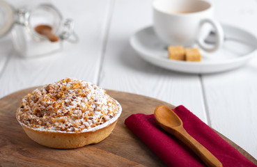 homemade cake with whipped cream and crushed nuts