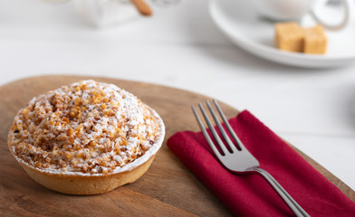 homemade cake with whipped cream and crushed nuts