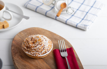 homemade cake with whipped cream and crushed nuts