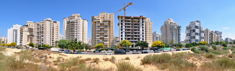 Panorama of a new residential area with modern houses and a large landscaping of the territory of the city of Holon in Israel
