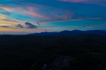 Amazing silhouette mountain sunset with colorful sky nature background