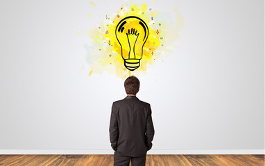 Businessman looking to a wall with new idea concept