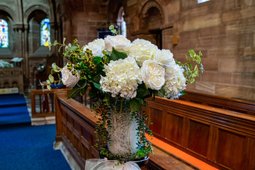 Fototapeta na wymiar flower decorations set inside a church
