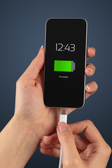 Elegant hand charging smartphone with low battery