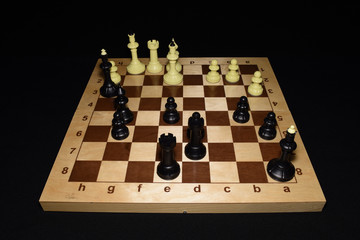 Chess board with black pawns as a hobby concept