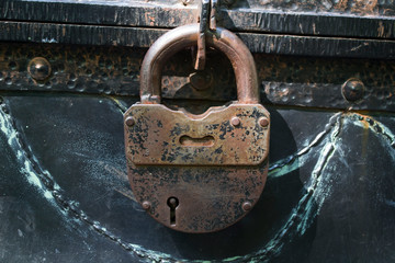 Antique chest with padlock.