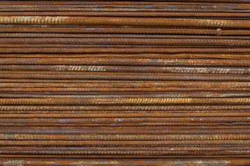 Top view stack of straight old rusty high yield stress deformed reinforcement steel or iron bars....
