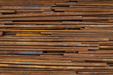 Top view stack of straight old rusty high yield stress deformed reinforcement steel or iron bars....
