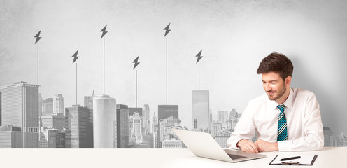 Announcer sitting at desk presenting the city energy consumption