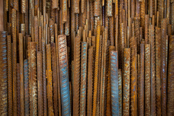Top view stack of straight old rusty high yield stress deformed reinforcement steel or iron bars....