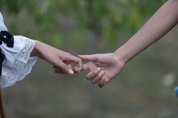 two hands touching, very young they touch their finger, love concept