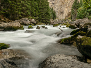 small river in the mountains, slow shutter speed for smooth water level and dreamy effect