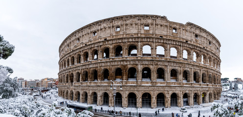 Fototapeta na wymiar The Roman Colosseum after a winder snowfall in Rome, Italy.