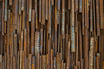 Top view stack of straight old rusty high yield stress deformed reinforcement steel or iron bars....