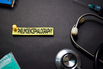 Pneumoencephalography text on Sticky Notes. Top view isolated on black background. Healthcare/Medical concept