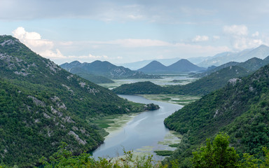 Obraz na płótnie Canvas River Rijeka Crnojevica loop, Skadar Lake National Park, from Pavlova Strana viewpoint on a sunny day, Skadarsko jezero, Crna Gora, Montenegro, Balkans, Europe