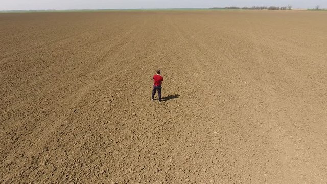 A man pisses in the open field. Urination in nature.