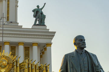 Soviet communist leader Vladimir Lenin statue in front of old building at VDNH in Moscow