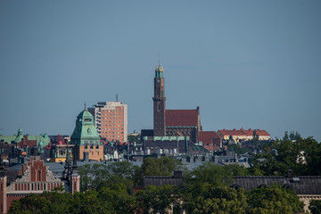 Fototapeta premium View over the island Djurgården, old town and district Södermalm with ferries and commuting boats in Stockholm.