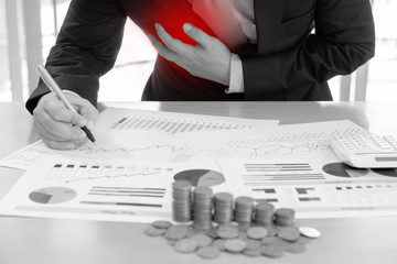 Businessman clutching his chest from acute pain. Heart attack symptom-Healthcare and medical concept