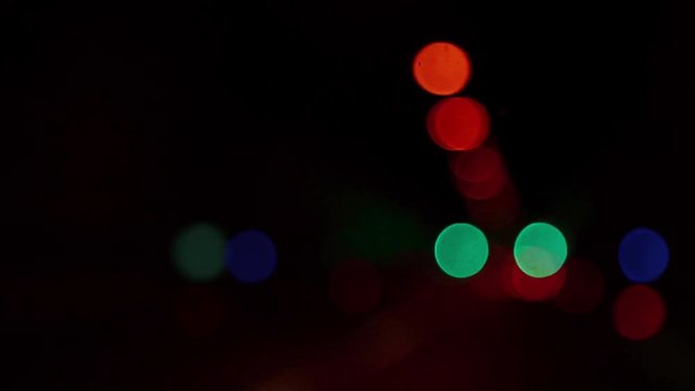 Blur background. Flickering bokeh circles of night traffic