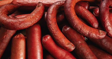 smoked sausage on wooden background