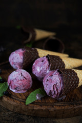 Obraz na płótnie Canvas Berry ice cream in a waffle cone