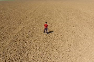 man pisses in the open field. Urination in nature.