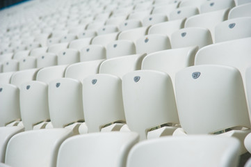 Empty white seats in stadium