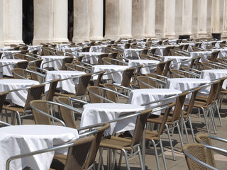 Gastronomy in Venice, tables and chairs at St Mark square