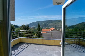 Balcony view of mountains. Landscape. Sunny Day.Terrace with a beautiful view.