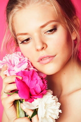 young beauty woman with flower peony pink closeup makeup soft tender gentle look