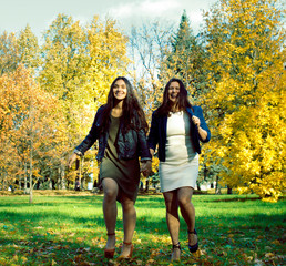 mature real mother with daughter outside autumn fall in park