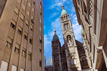 Basilica del Santisimo Sacramento church in Buenos Aires, Argentina, against a blue summer sky.