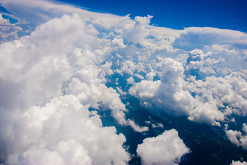 Naklejka na ściany i meble Aerial view of clouds from an airplane.