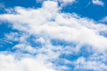 bright blue sky with white fluffy clouds